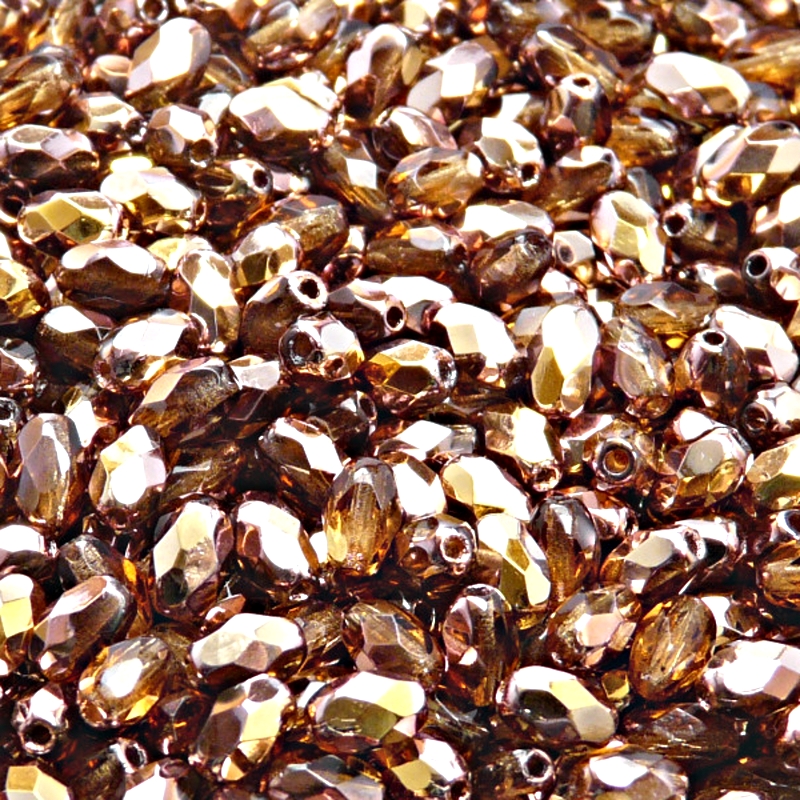 50ks České skleněné broušené tvarové ohňovky olivy 6x4mm kouřový topas/ gold capri polopokov
